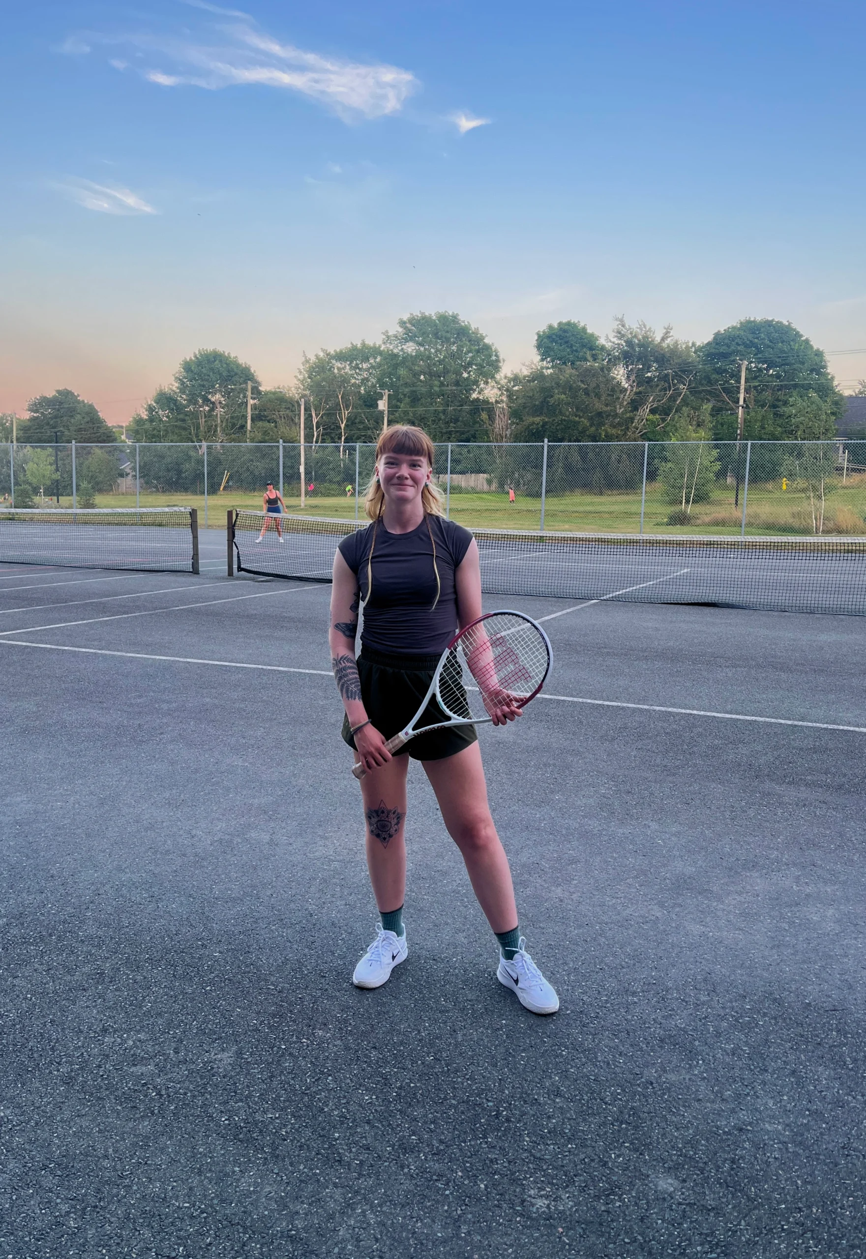 Tennis player with racket on court at Cowan Park, St. John’s